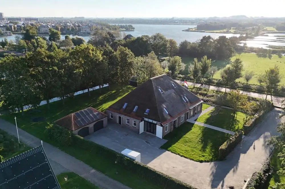 Middenweg 1E from the air: the yard, its own garden and Park van Luna in the background